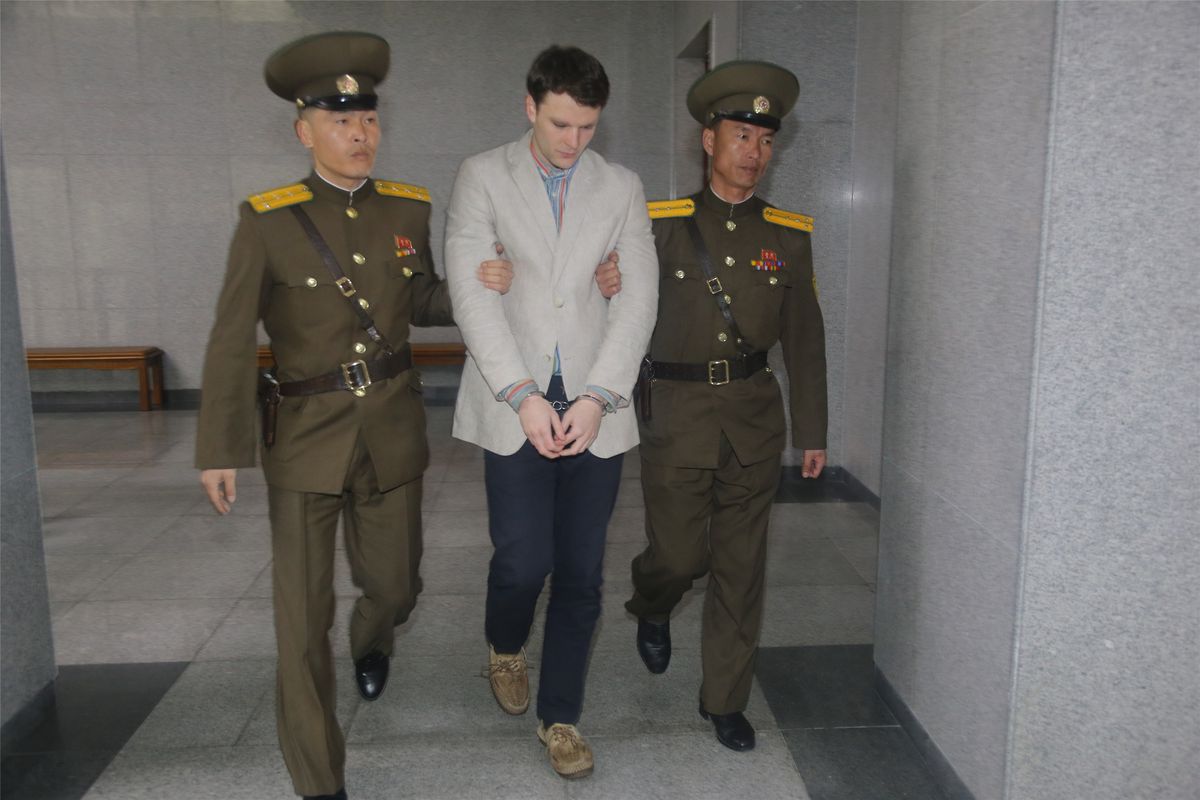 A picture of Otto Warmbier being taking away by North Korean soldiers