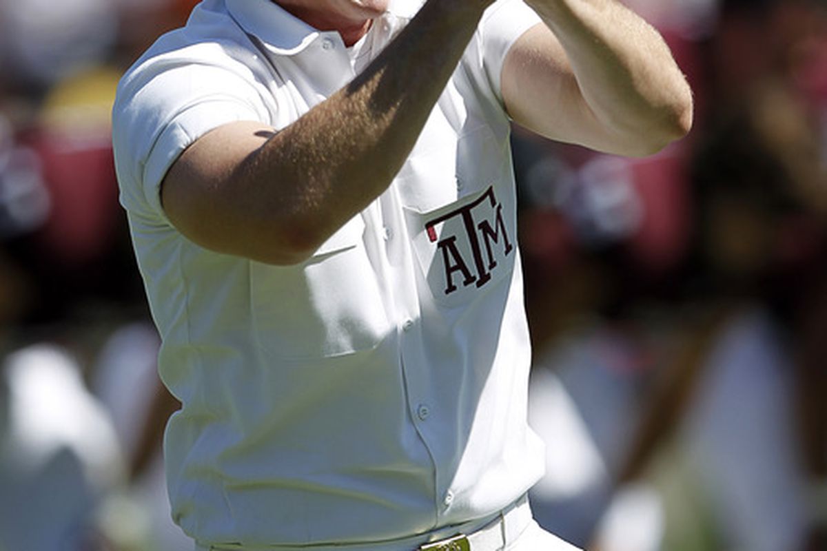 <em>A&M yell leader attempts to shoot down an AT&T satellite.  </em>