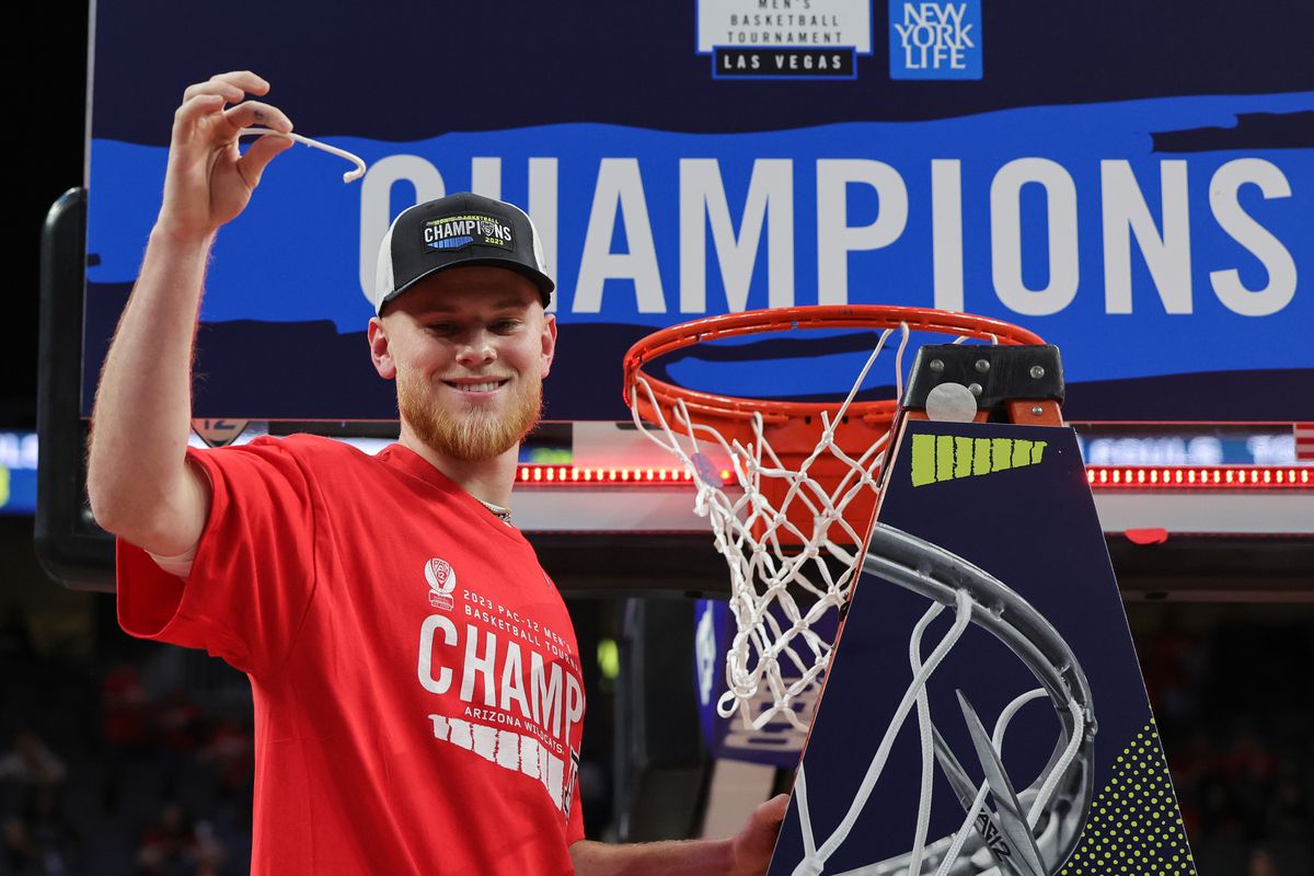 Luc Krystkowiak #42 of the Arizona Wildcats poses after cutting a piece of a net down after the team’s 61-59 victory over the UCLA Bruins to win the championship game of the Pac-12 basketball tournament at T-Mobile Arena on March 11, 2023 in Las Vegas, Nevada.