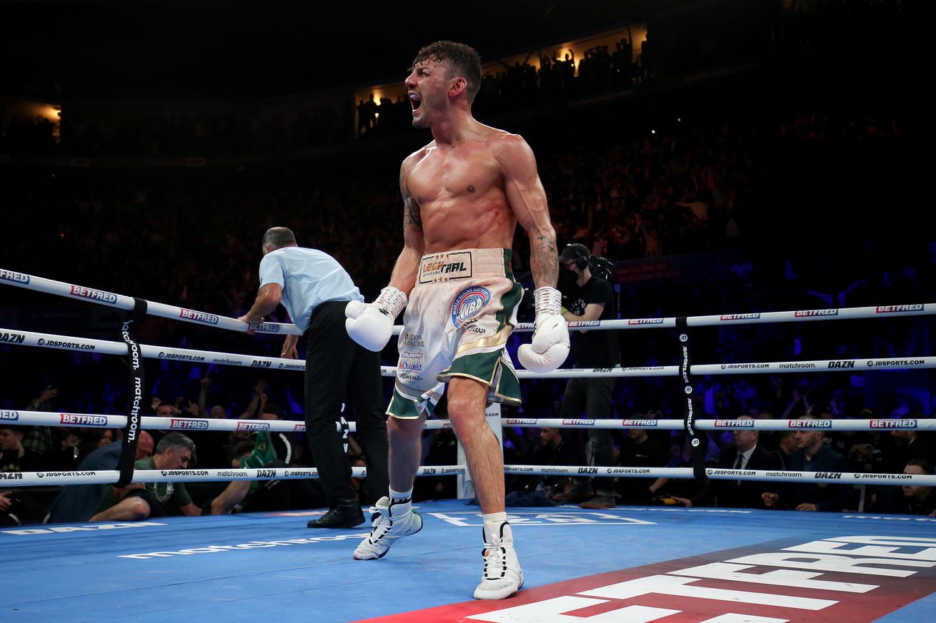 Leigh Wood celebrates after knocking Michael Conlan out of the ring