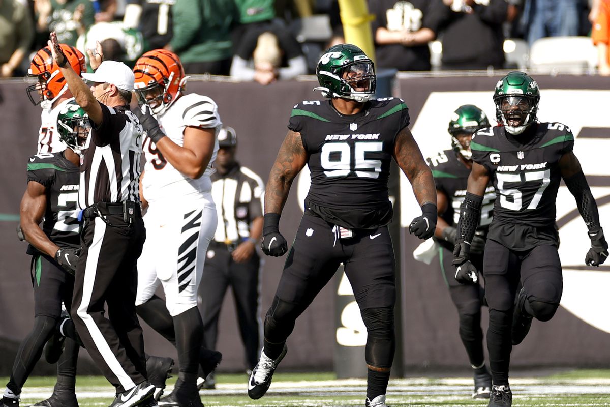 Quinnen Williams #95 of the New York Jets reacts after sacking Joe Burrow #9 of the Cincinnati Bengals during the first quarter at MetLife Stadium on October 31, 2021 in East Rutherford, New Jersey.