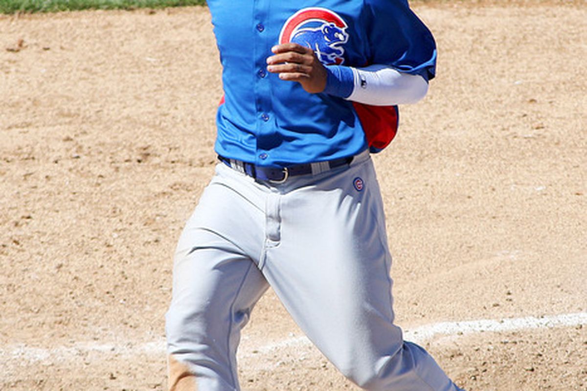 Surprise, AZ, USA; Chicago Cubs center fielder Dave Sappelt touches home after scoring in a spring training game.  Credit: Jake Roth-US PRESSWIRE