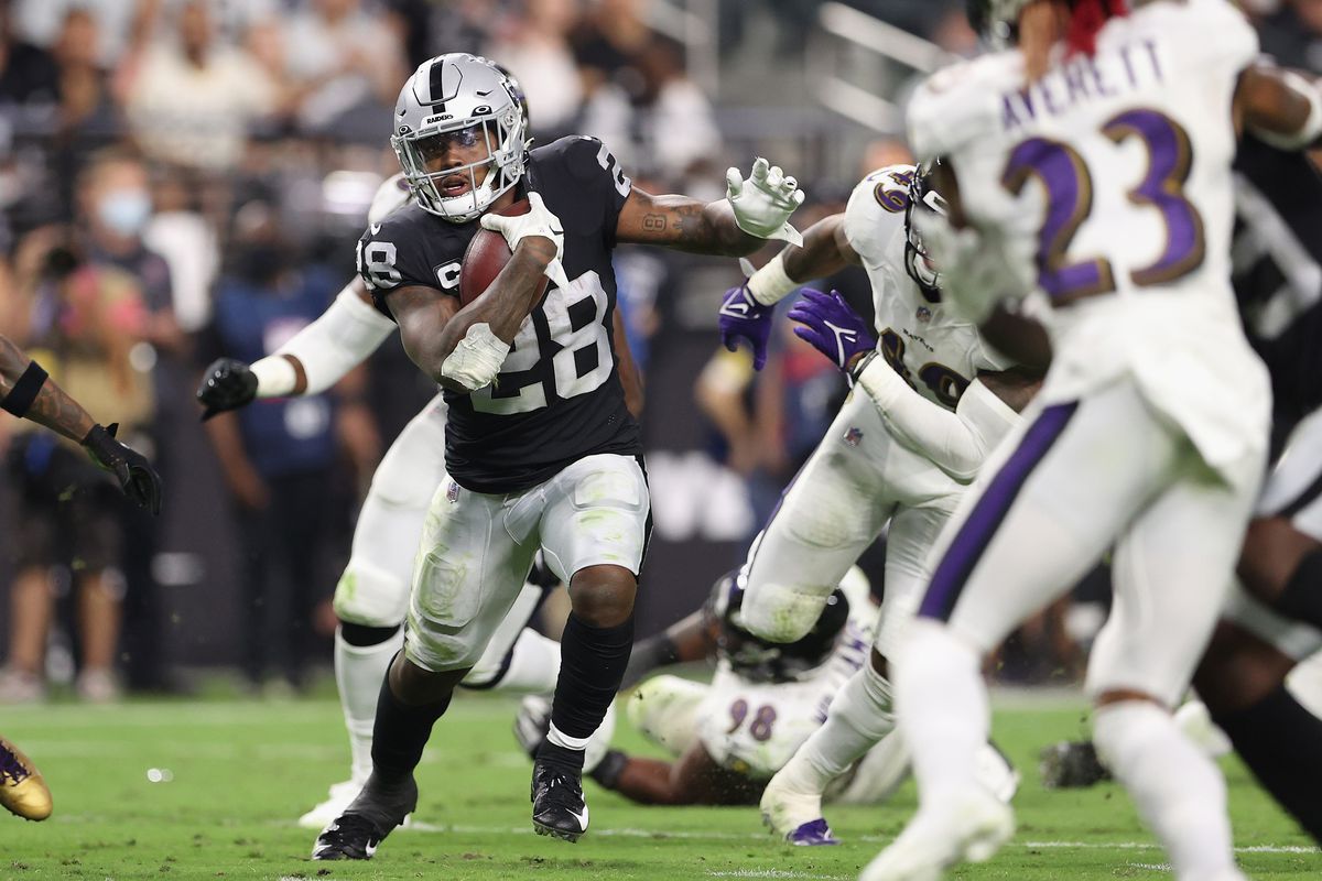 Running back Josh Jacobs of the Las Vegas Raiders rushes the football against the Baltimore Ravens during the NFL game at Allegiant Stadium on September 13, 2021 in Las Vegas, Nevada.