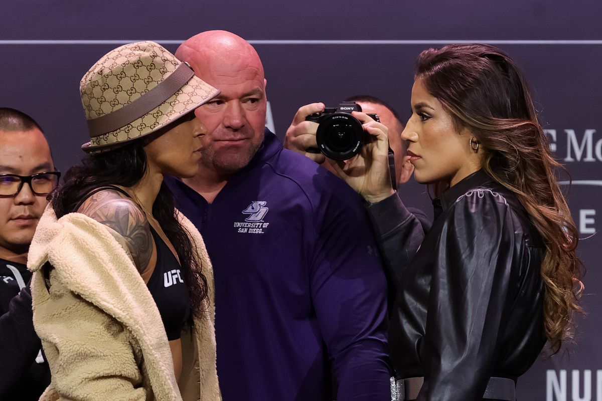 Amanda Nunes of Brazil and Julianna Pena face off during the UFC 269 press conference at MGM Grand Garden Arena on December 09, 2021 in Las Vegas, Nevada.