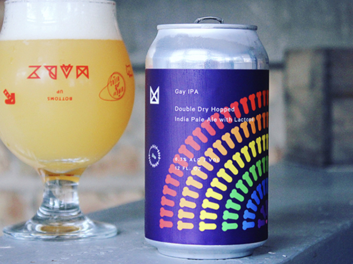 A can of beer with a rainbow design.