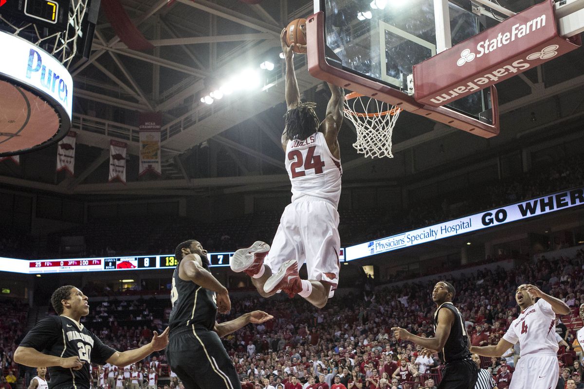 Nov 19, 2014; Fayetteville, AR, USA; Arkansas Razorbacks guard Michael Qualls (24) dunks the ball in against the Wake Forest Demon Deacons during the first half at Bud Walton Arena.