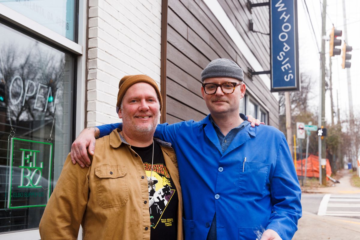 Chef Hudson Rouse and Tim Faulkner, arms around each other’s shoulders, standing outside the Reynoldstown, Atlanta, bar and restaurant Whoopsie’s. 