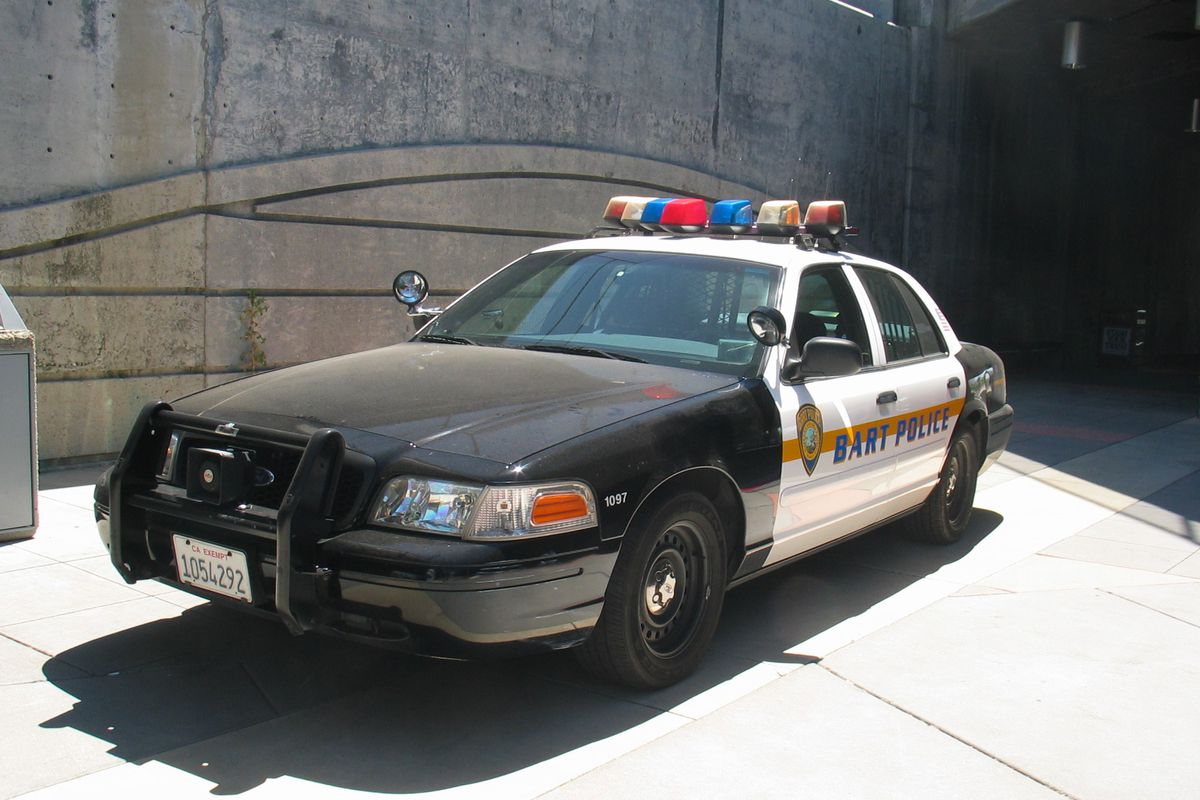 A BART Police cruiser parked near a station.