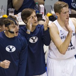 Brigham Young forward Davin Guinn (24) pumps his fist after a teammate made a 3-pointer during an NCAA college basketball game against Coppin State in Provo on Thursday, Nov. 17, 2016.