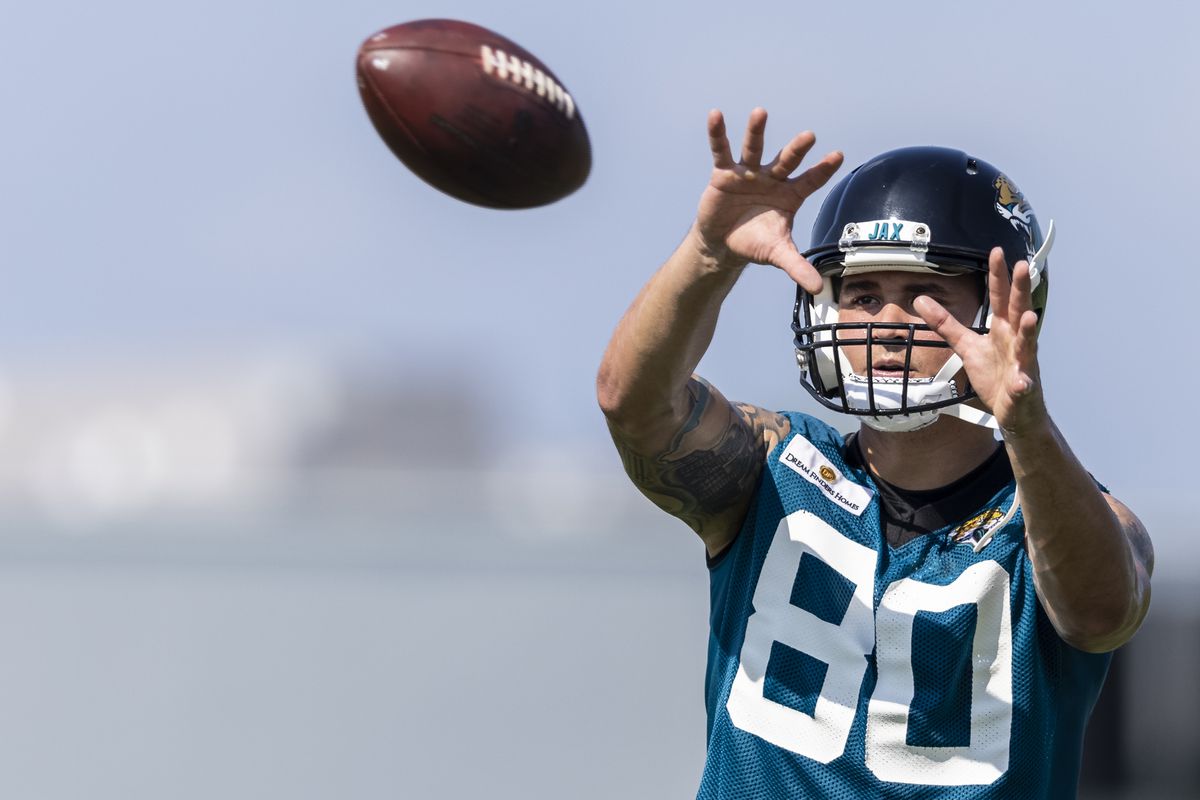 James O’Shaughnessy #80 of the Jacksonville Jaguars catches a pass during training camp at TIAA Bank Field on July 28, 2021 in Jacksonville, Florida.
