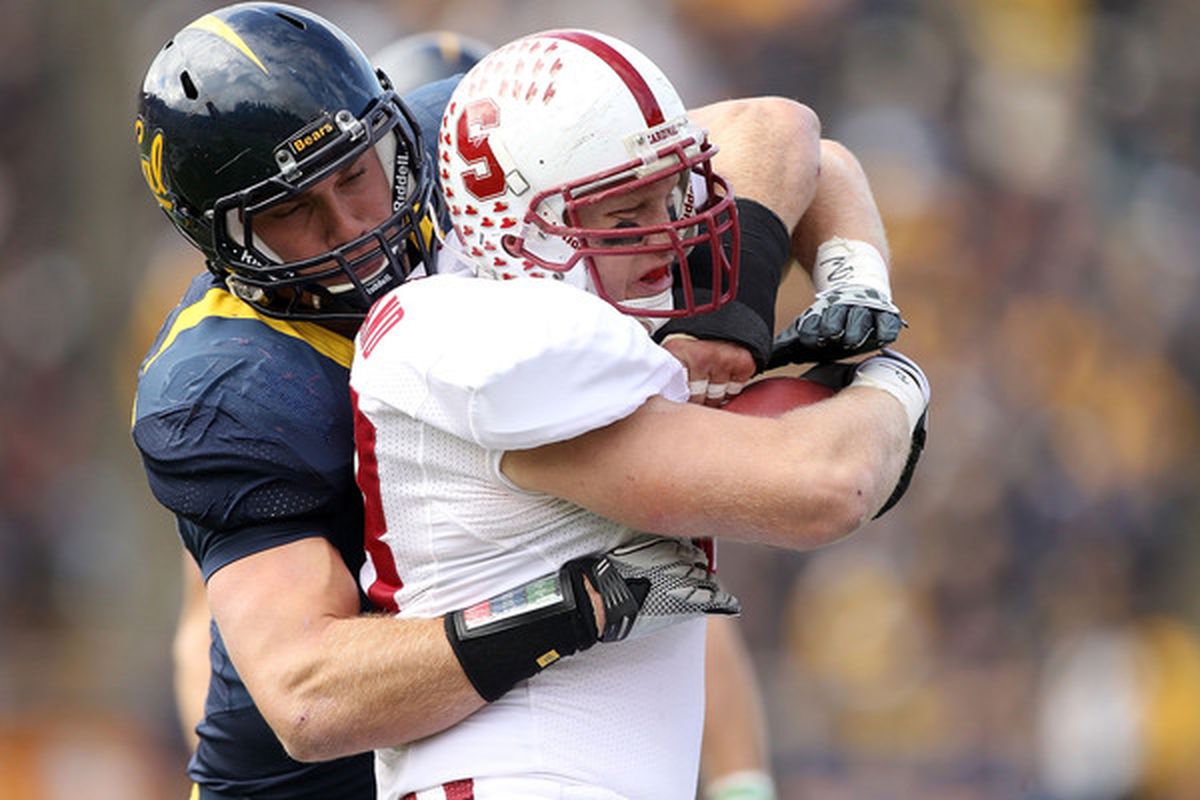 BERKELEY CA - NOVEMBER 20:  Konrad Reuland #88 of the Stanford Cardinal is tackled by Mike Mohamed #18 of the California Golden Bears at California Memorial Stadium on November 20 2010 in Berkeley California.  (Photo by Ezra Shaw/Getty Images)