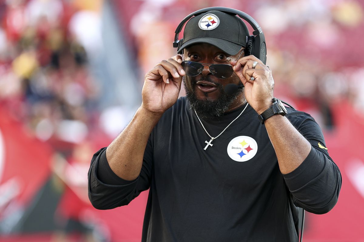 Head coach Mike Tomlin of the Pittsburgh Steelers puts on sunglasses prior to an NFL preseason football game against the Tampa Bay Buccaneers at Raymond James Stadium on August 11, 2023 in Tampa, Florida.