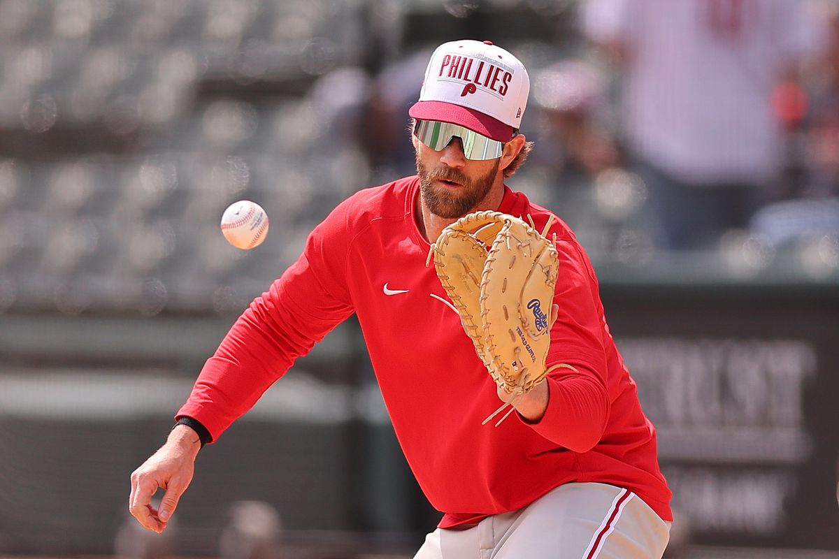 Bryce Harper of the Philadelphia Phillies takes infield at first base prior to the game against the Chicago White Sox at Guaranteed Rate Field on April 19, 2023 in Chicago, Illinois.