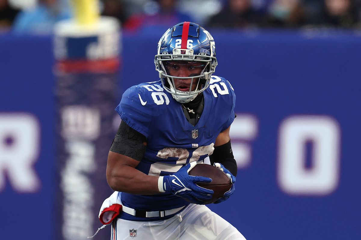 Running back Saquon Barkley #26 of the New York Giants carries the ball during the game against the Detroit Lions at MetLife Stadium on November 20, 2022 in East Rutherford, New Jersey.