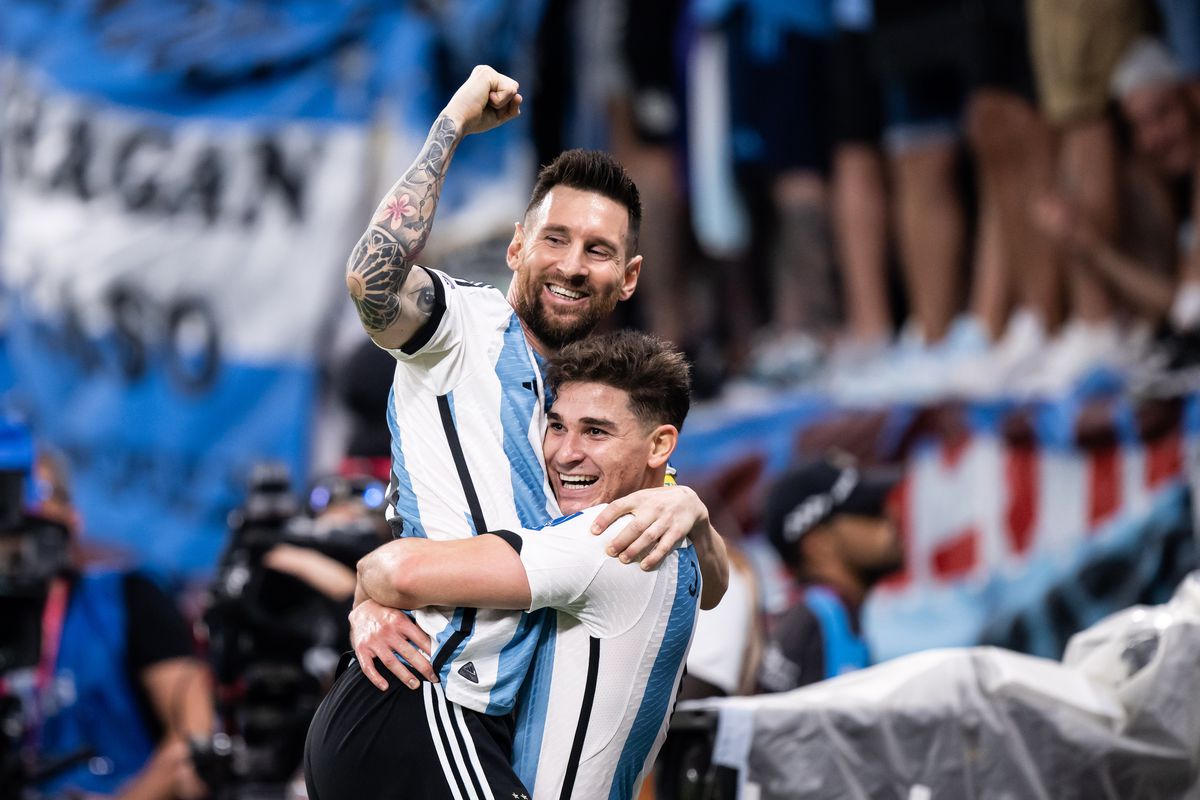 Julian Alvarez (R) of Argentina celebrates with Lionel Messi (L) after scoring his team’s second goal during the FIFA World Cup Qatar 2022 Round of 16 match between Argentina and Australia at Ahmad Bin Ali Stadium on December 03, 2022 in Doha, Qatar.