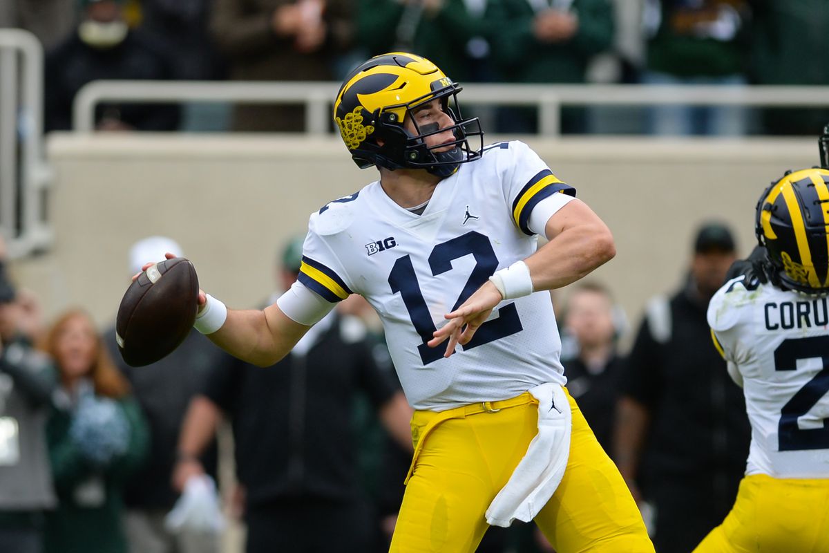 Michigan Wolverines quarterback Cade McNamara unloads a deep pass during a college football game between the Michigan State Spartans and the Michigan Wolverines on October 30, 2021 at Spartan Stadium in East Lansing, MI.
