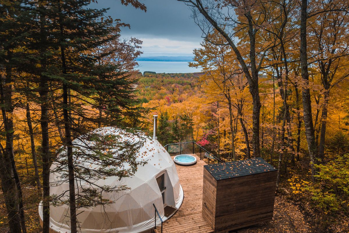Dome on wooden deck overlooking trees