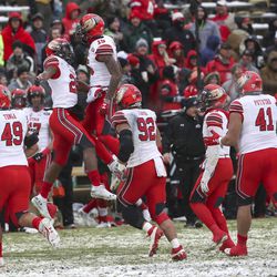 The Utah defense celebrates after stopping a fake point try during the University of Utah football game against the University of Colorado at Folsom Field in Boulder, Colorado, on Saturday, Nov. 17, 2018.