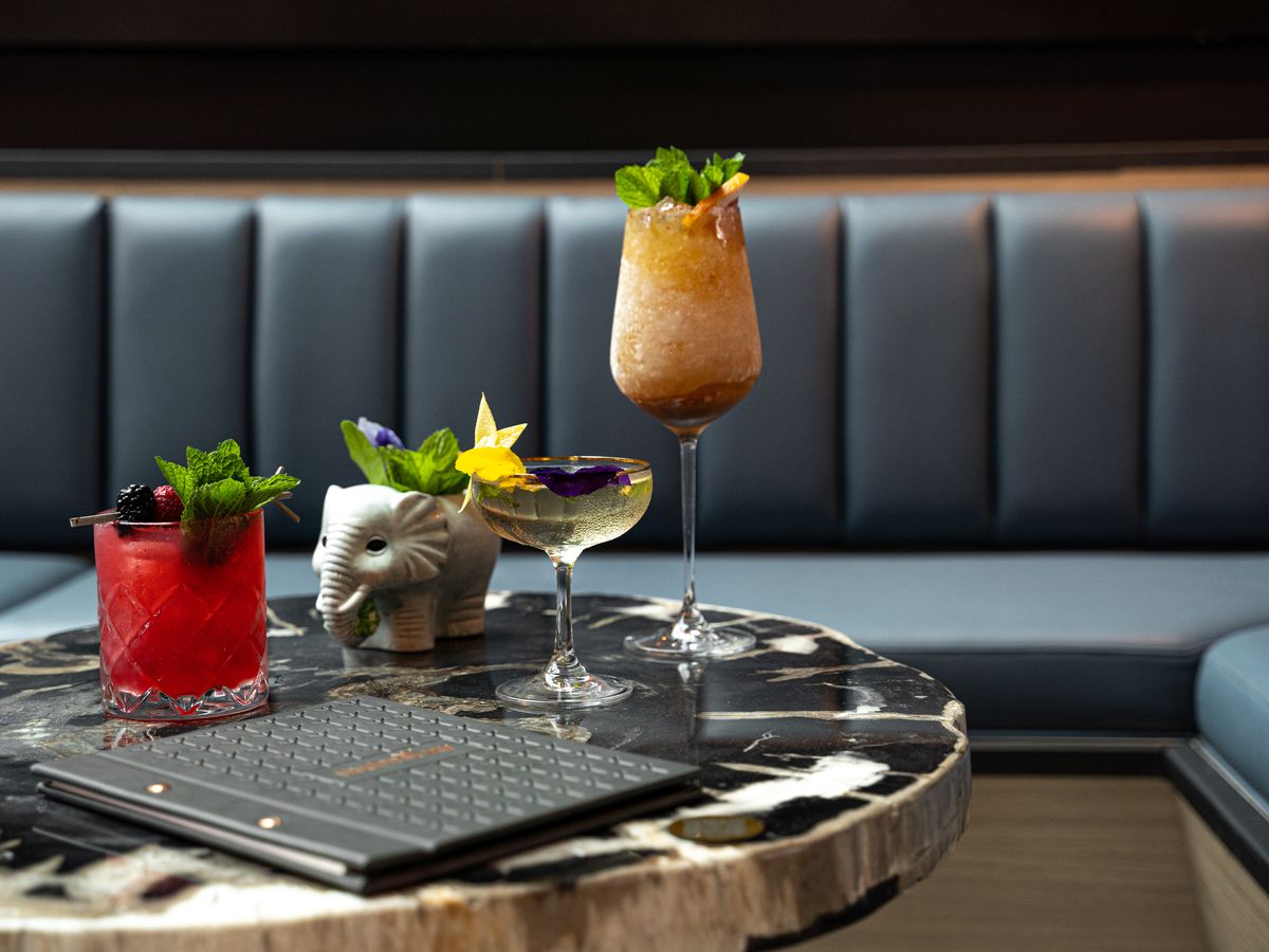 An artful arrangement of cocktails on a bar table.