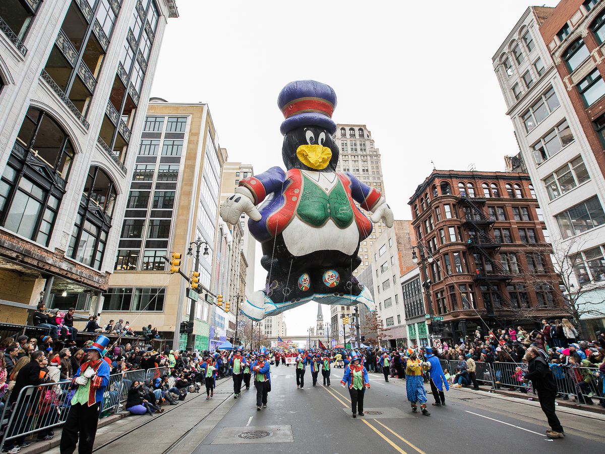 A giant penguin balloon dressed in a top hat and vest at the Thanksgiving Parade in downtown Detroit.