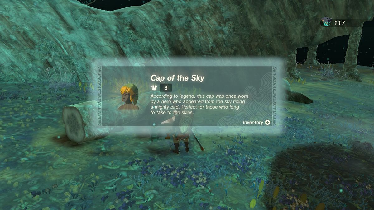 Link opens a chest containing the Cap of the Sky near a tree trunk in Zelda Tears of the Kingdom.