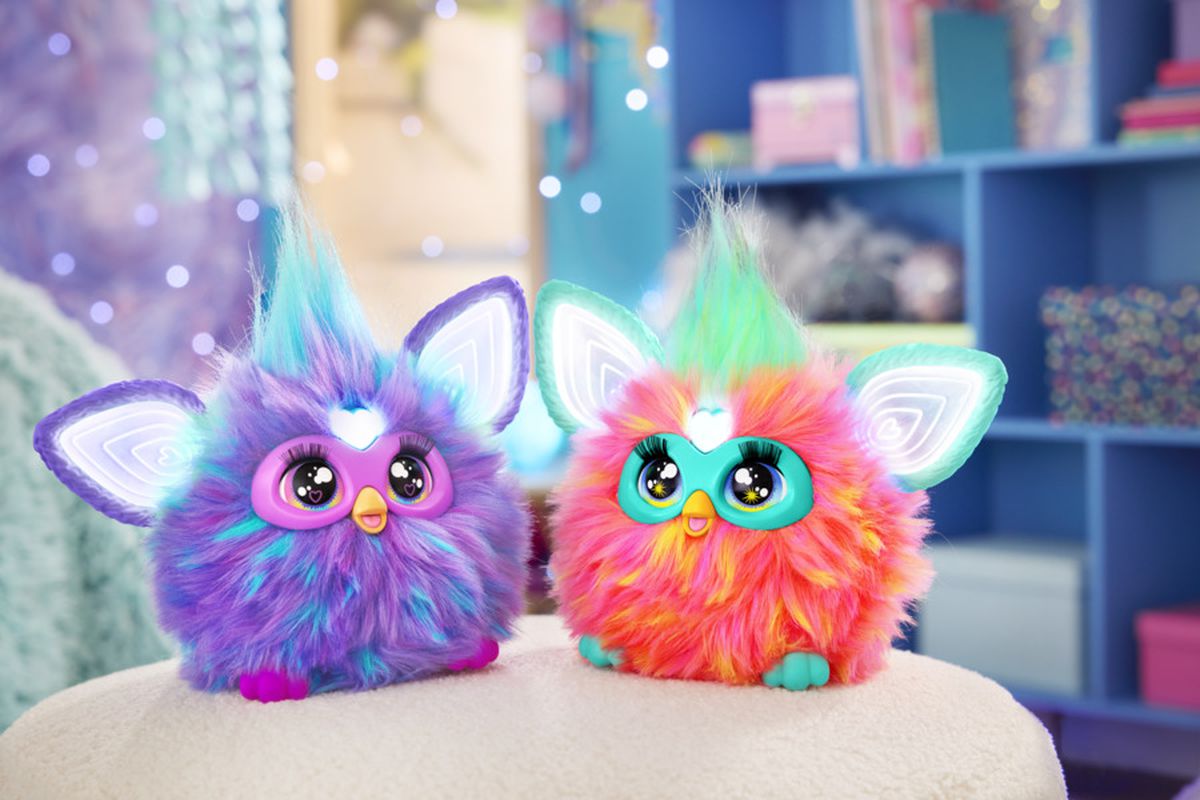 An official photo from Hasbro Inc. shows two new Furby dolls sitting next to each other.