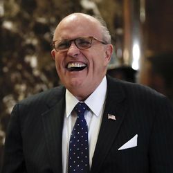 Former New York Mayor Rudy Giuliani laughs as he arrives at Trump Tower, Wednesday, Nov. 16, 2016, in New York. 