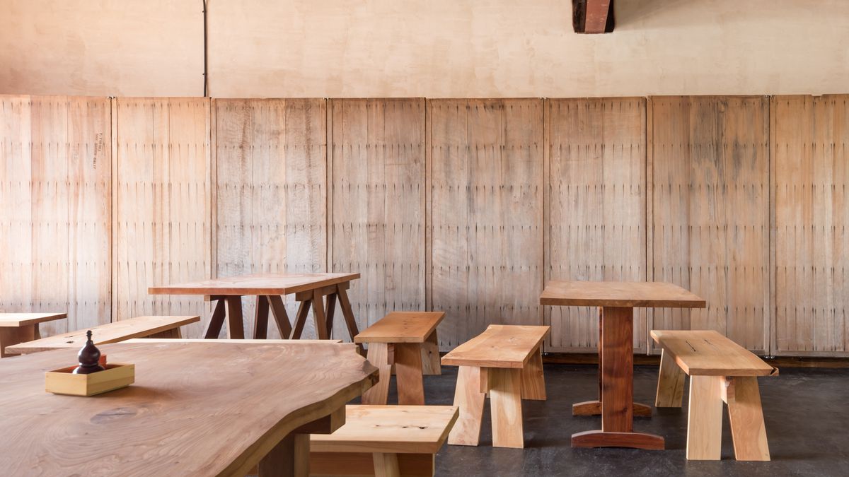 Interior shot of the table layout at Soba Ichi, with pale wood tables and benches