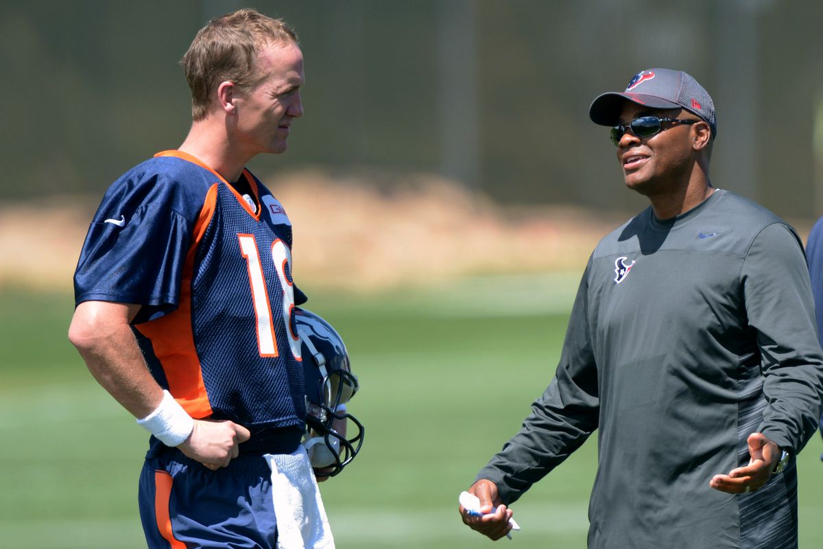 Broncos QB Peyton Manning with Texans GM Rick Smith, formerly of the Broncos.