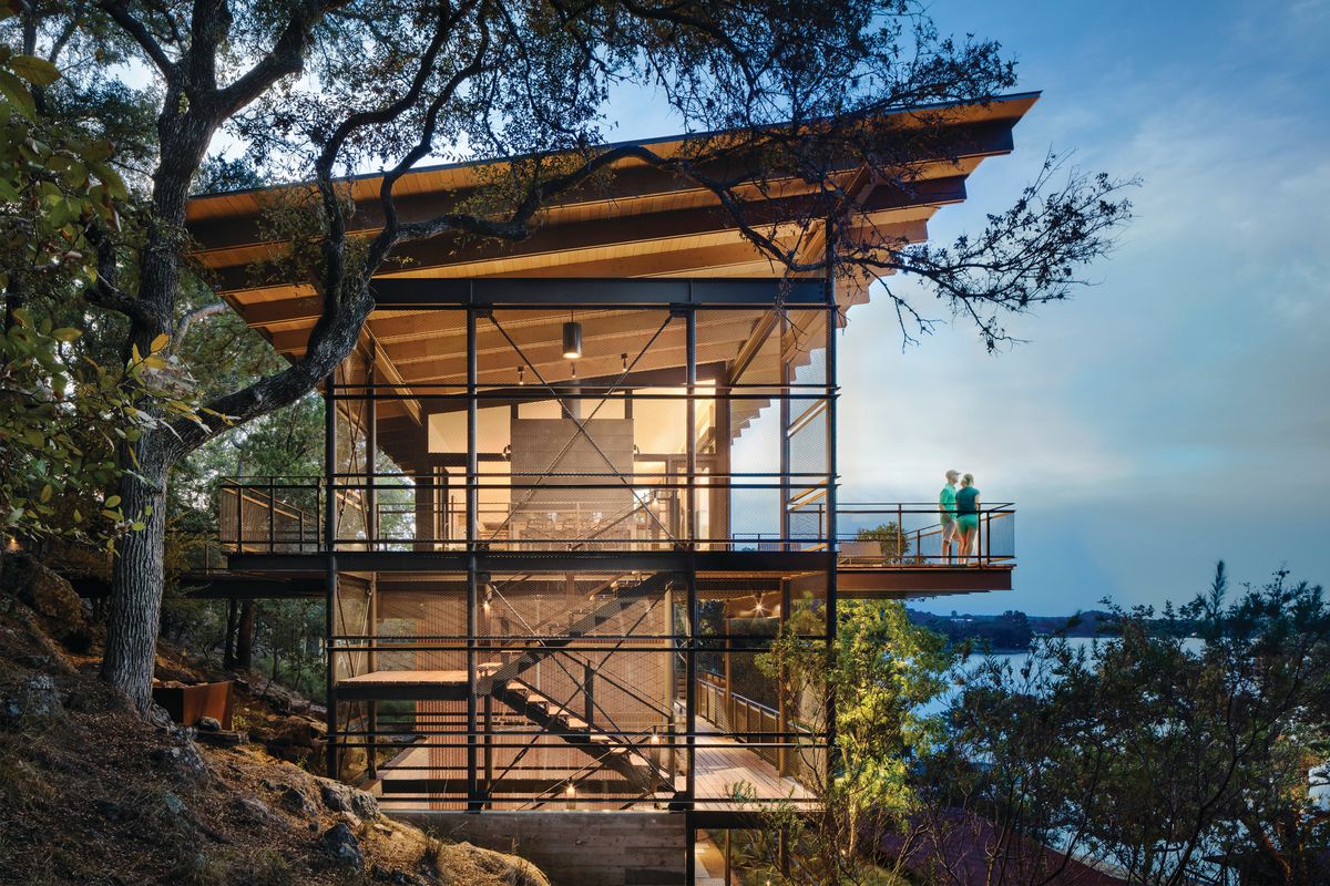Two story house overlooking lake, canitlevered glass contemporary