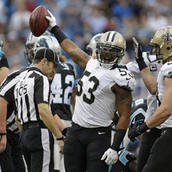 New Orleans Saints' Ramon Humber (53) reacts after recovering an onside kick against the Carolina Panthers in the first half of an NFL football game in Charlotte, N.C., Sunday, Dec. 22, 2013. 