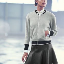 The women's varsity sweatshirt jacket, Collection plaza skirt in laser-cut leather, and the leather brim baseball cap