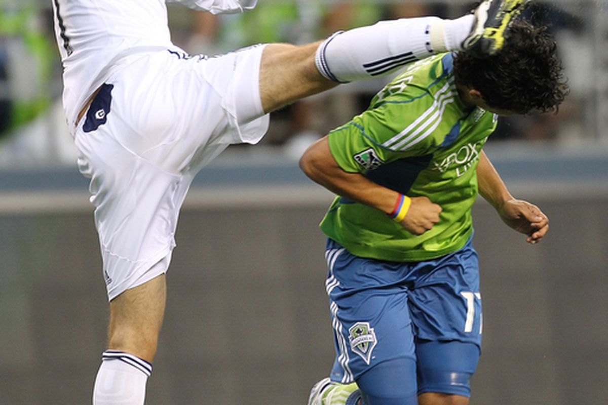 SEATTLE - AUGUST 28:  Fredy Montero #17 of the Seattle Sounders FC gets a foot in the head from Gonzalo Segares #31 of the Chicago Fire on August 28 2010 at Qwest Field in Seattle Washington.  (Photo by Otto Greule Jr/Getty Images)