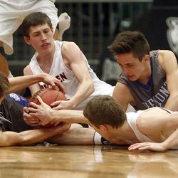 American Fork and Fremont battle for a loose ball in the first round of the 5A boys basketball tournament at the UCCU Events Center in Orem, Tuesday, March 1, 2016.