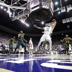 BYU's #0 Brandon Davies stretches out trying for a rebound as BYU and Baylor play Saturday, Dec. 17, 2011 in the Marriott Center in Provo. Baylor won 86-83.