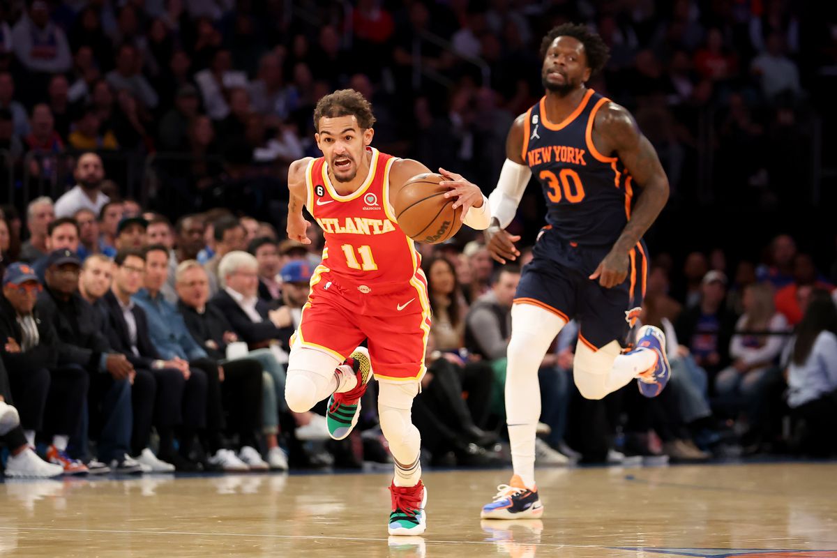 Atlanta Hawks guard Trae Young (11) brings the ball up court after a turnover by New York Knicks forward Julius Randle (30) during the first quarter at Madison Square Garden.