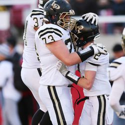 Lone Peak's Tyler MacPherson (2) celebrates his touchdown against Bingham in the 5A state championship high school football game in Salt Lake City on Friday, Nov. 18, 2016.