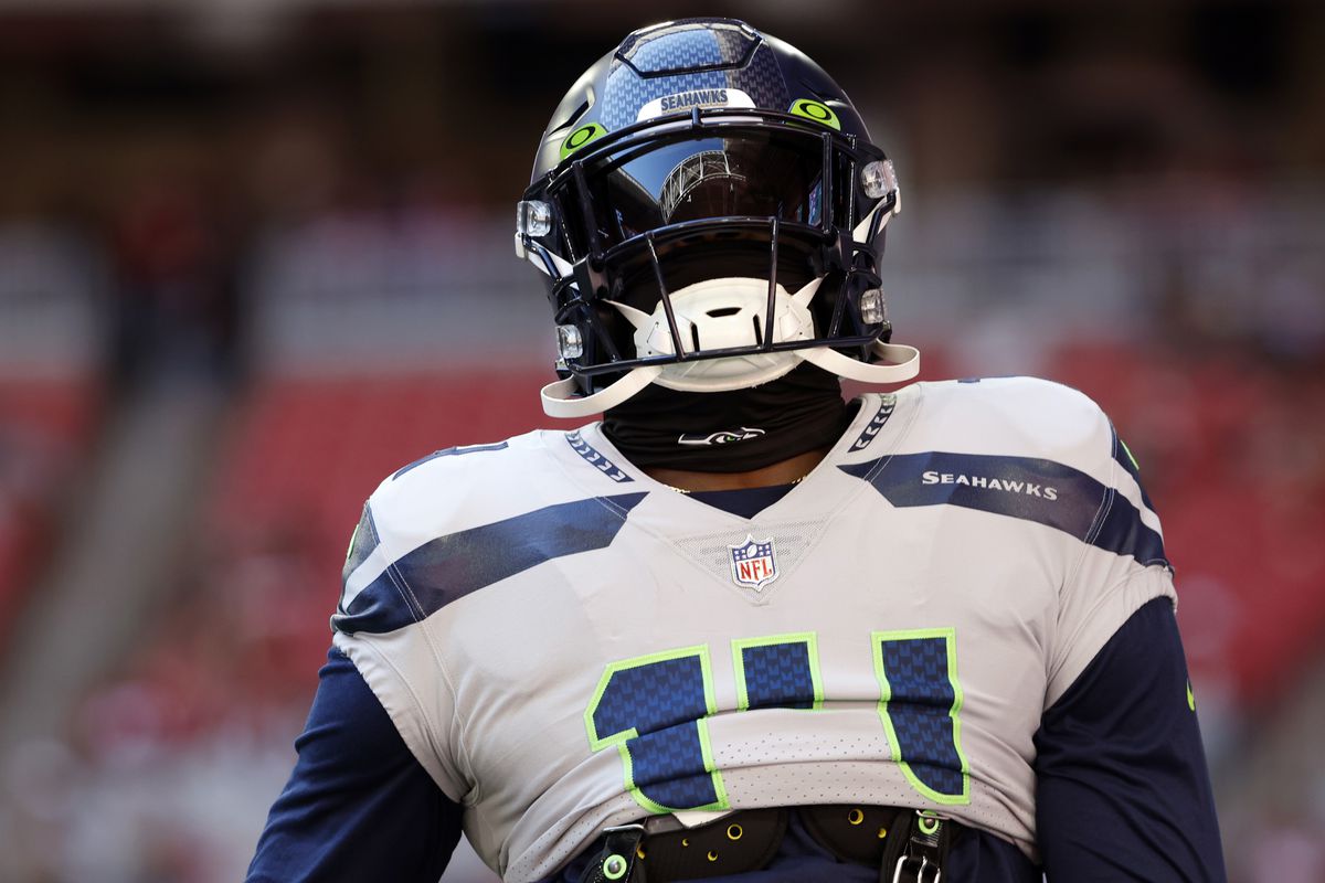 Wide receiver DK Metcalf #14 of the Seattle Seahawks warms up before the game against the Arizona Cardinals at State Farm Stadium on November 06, 2022 in Glendale, Arizona. The Seahawks beat the Cardinals 31-21.