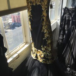 Black mermaid gown with gold embroidery, $1,200