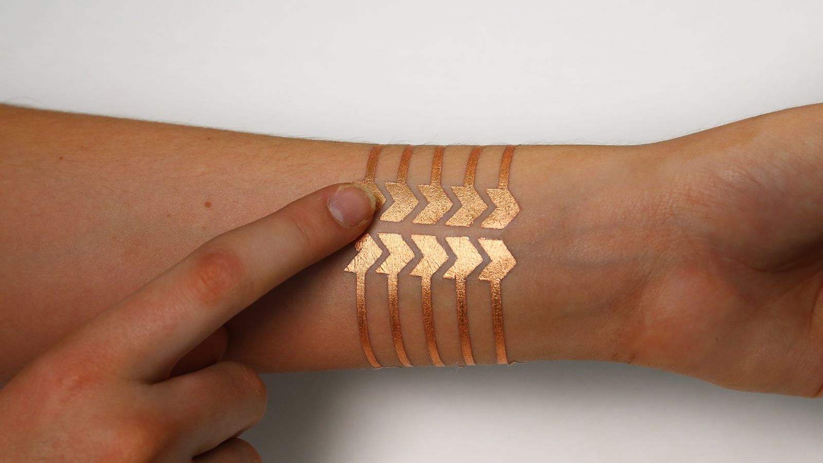 MIT and Microsoft Research made a 'smart' tattoo that remotely controls your phone - The Verge