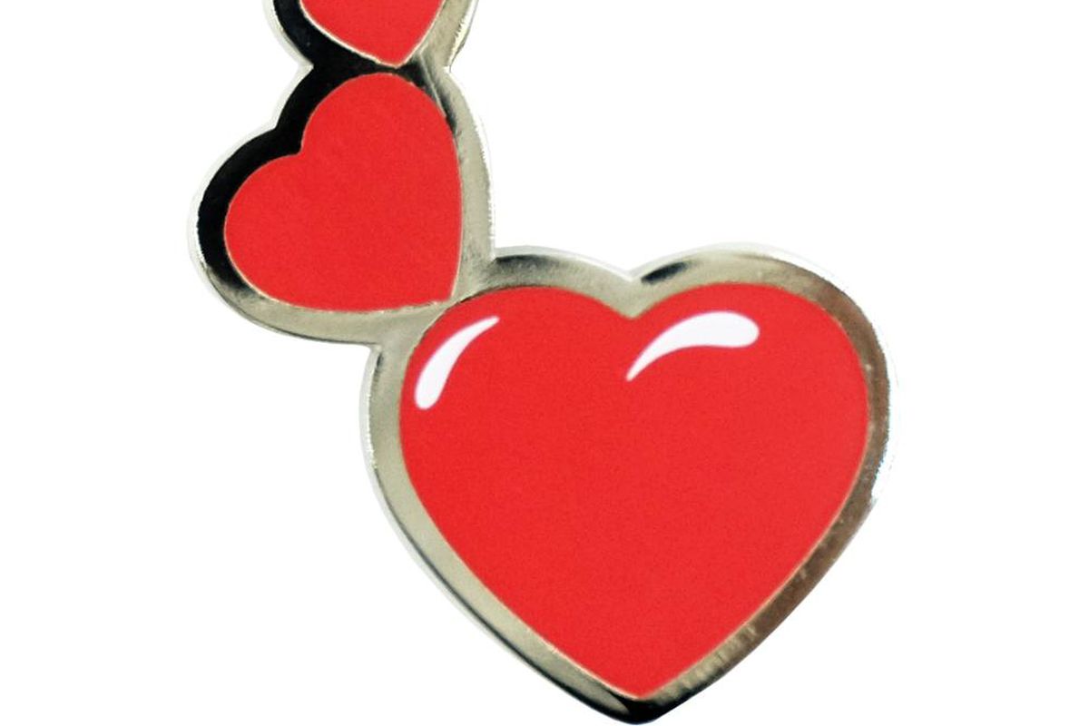 A series of three red hearts with a silver rim.