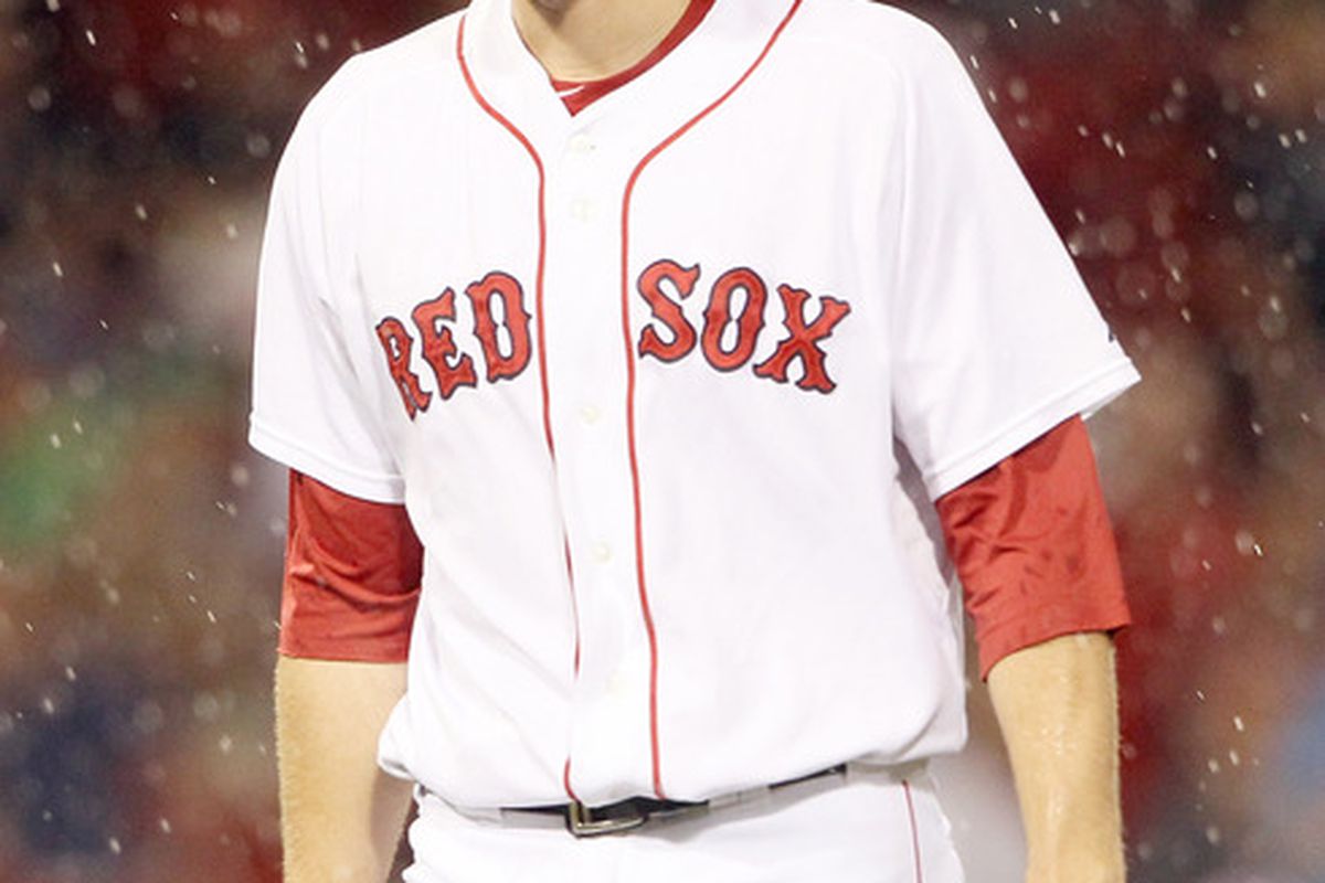 BOSTON, MA - JULY 06:  Daniel Bard #51 of the Boston Red Sox heads in during a rain delay in the eighth inning against the Toronto Blue Jays on July 6, 2011 at Fenway Park in Boston, Massachusetts.  (Photo by Elsa/Getty Images)