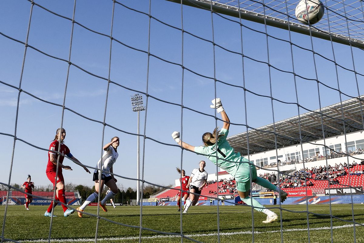 Captain Lea Schüller and nearby defenders watch as her shot thumps into the back of the net beyond the Serbia keeper’s outstretched arms