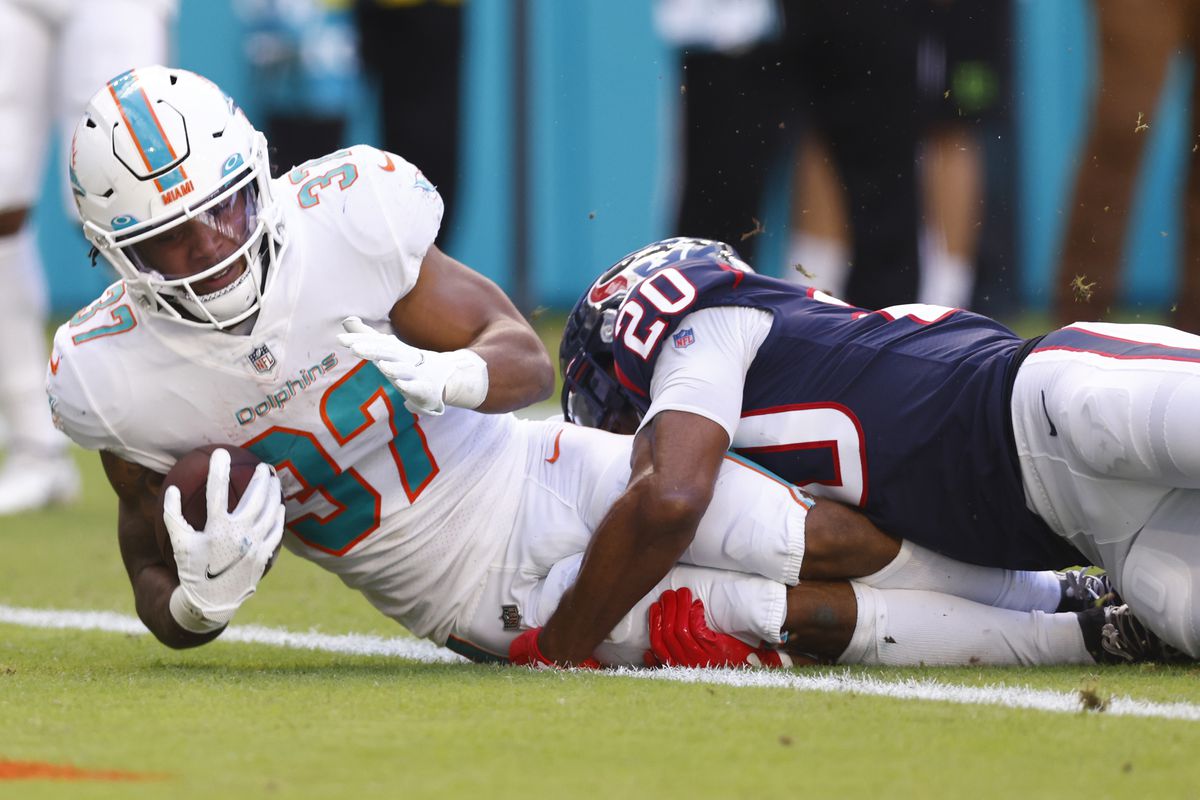 Myles Gaskin #37 of the Miami Dolphins scores a touchdown against the Houston Texans in the first quarter at Hard Rock Stadium on November 07, 2021 in Miami Gardens, Florida.