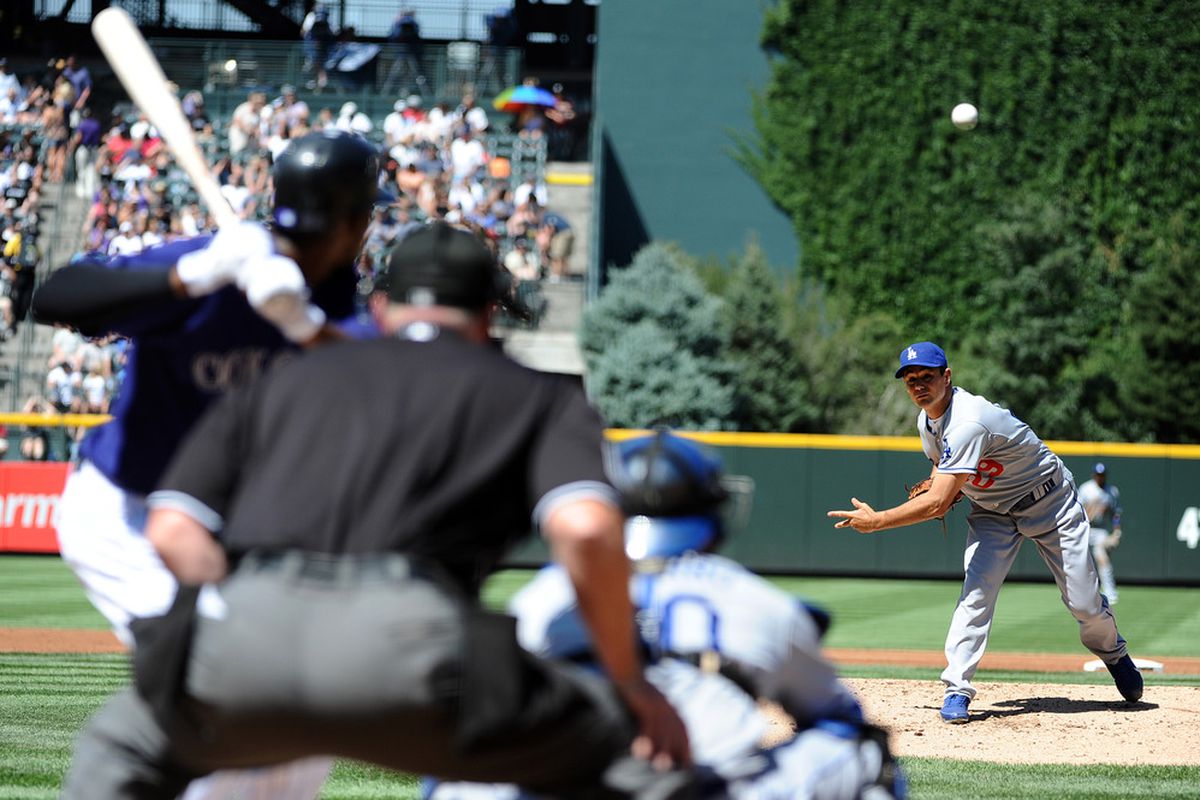DENVER, CO - AUGUST 20:  Ted Lilly #29 of the Los Angeles Dodgers pitches during the game against the Colorado Rockies at Coors Field on August 20, 2011 in Denver, Colorado.  (Photo by Garrett W. Ellwood/Getty Images)