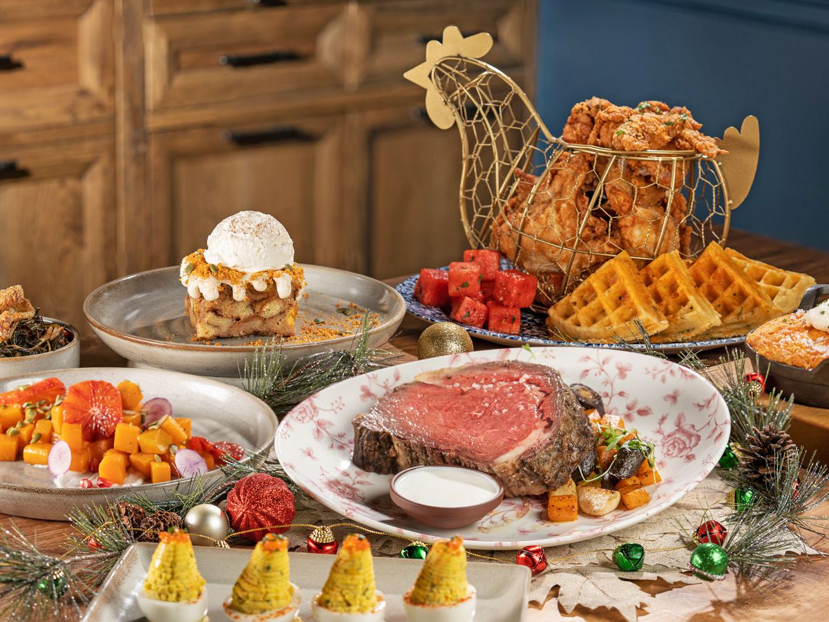A Christmas feast with prime rib and waffles.