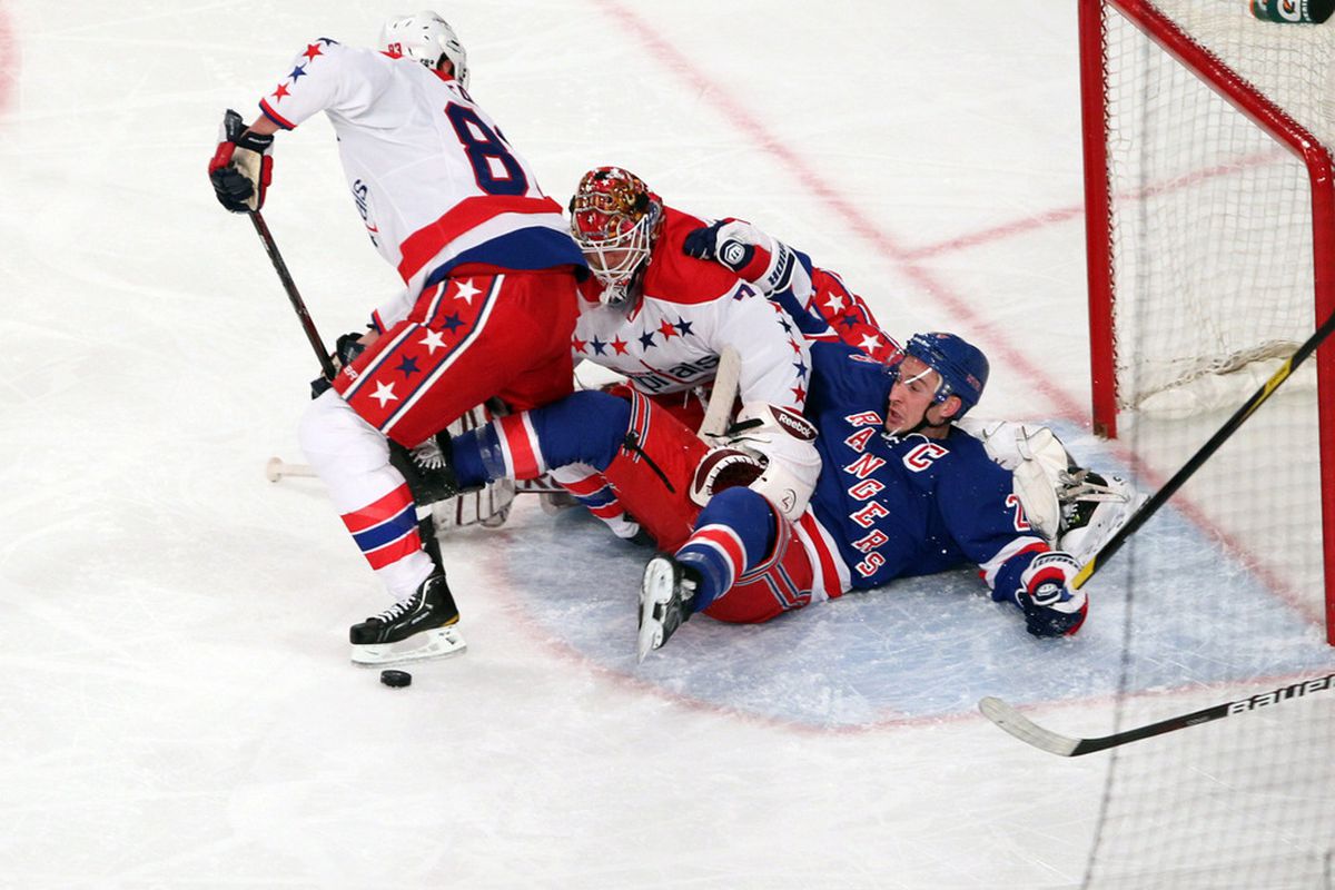 Apr 7 2012; New York, NY, USA;  Washington Capitals goalie Braden Holtby (70) makes a save over New York Rangers defenseman Ryan McDonagh (27) during the second period at Madison Square Garden.  Mandatory Credit: Anthony Gruppuso-US PRESSWIRE