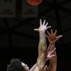 Utah Utes guard Devon Daniels (3) lays it up over Concordia defenders during a game at the Hunstman Center in Salt Lake City on Tuesday, Nov. 15, 2016.