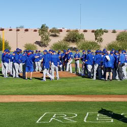 Players gathering for meeting on the mound -