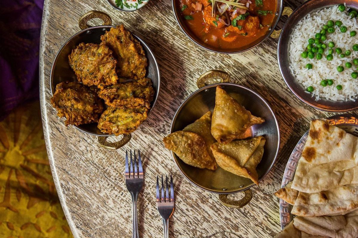 An array of Indian dishes on a table.
